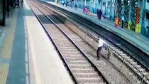 Thumbnail for Pajeet risks death by train trying to put on shoe. Rescued by another poo in nick of time, who promptly bops him on head