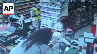 Thumbnail for Clerk grabs baby from woman before she collapses | Associated Press