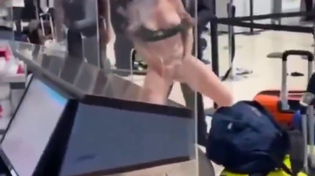 Thumbnail for Woman freaks out at the airport (NSFW)