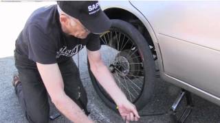 Thumbnail for Bicycle Wheel On Car | Bill Mould
